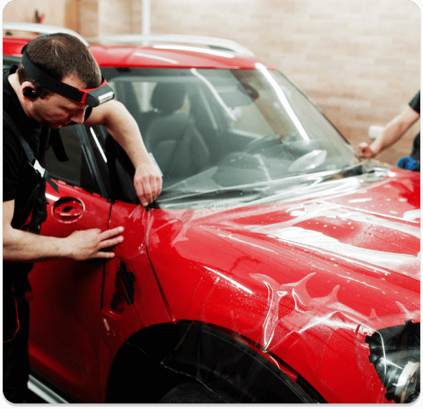 3M Scotchgard Pro Series paint protection film being applied to a vehicle
