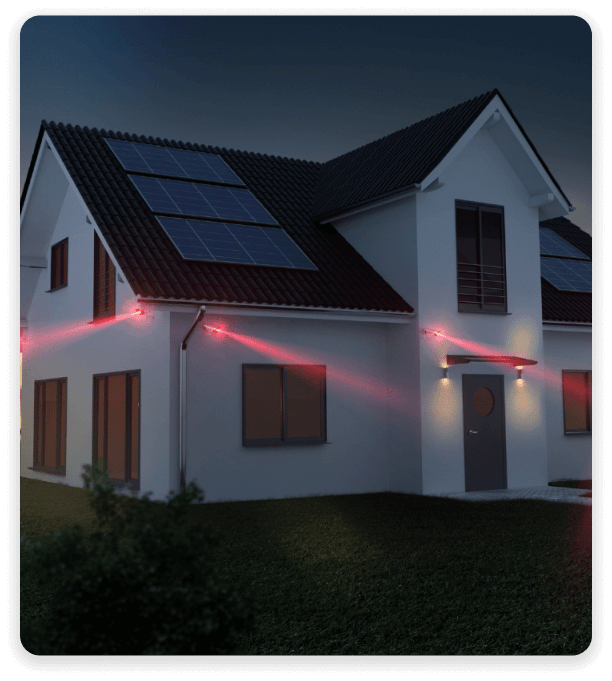 House at night with red security-sensor beams sweeping across its windows and doors